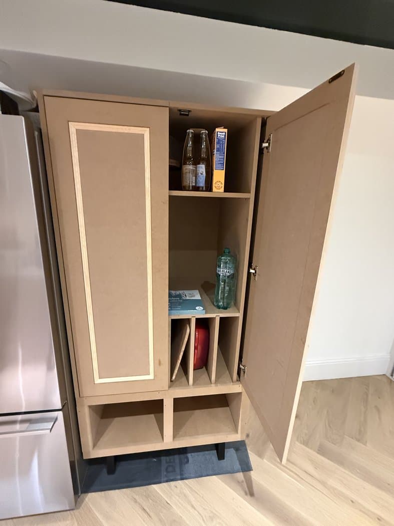 Tall pantry cupboard with adjustable shelves and tray dividers