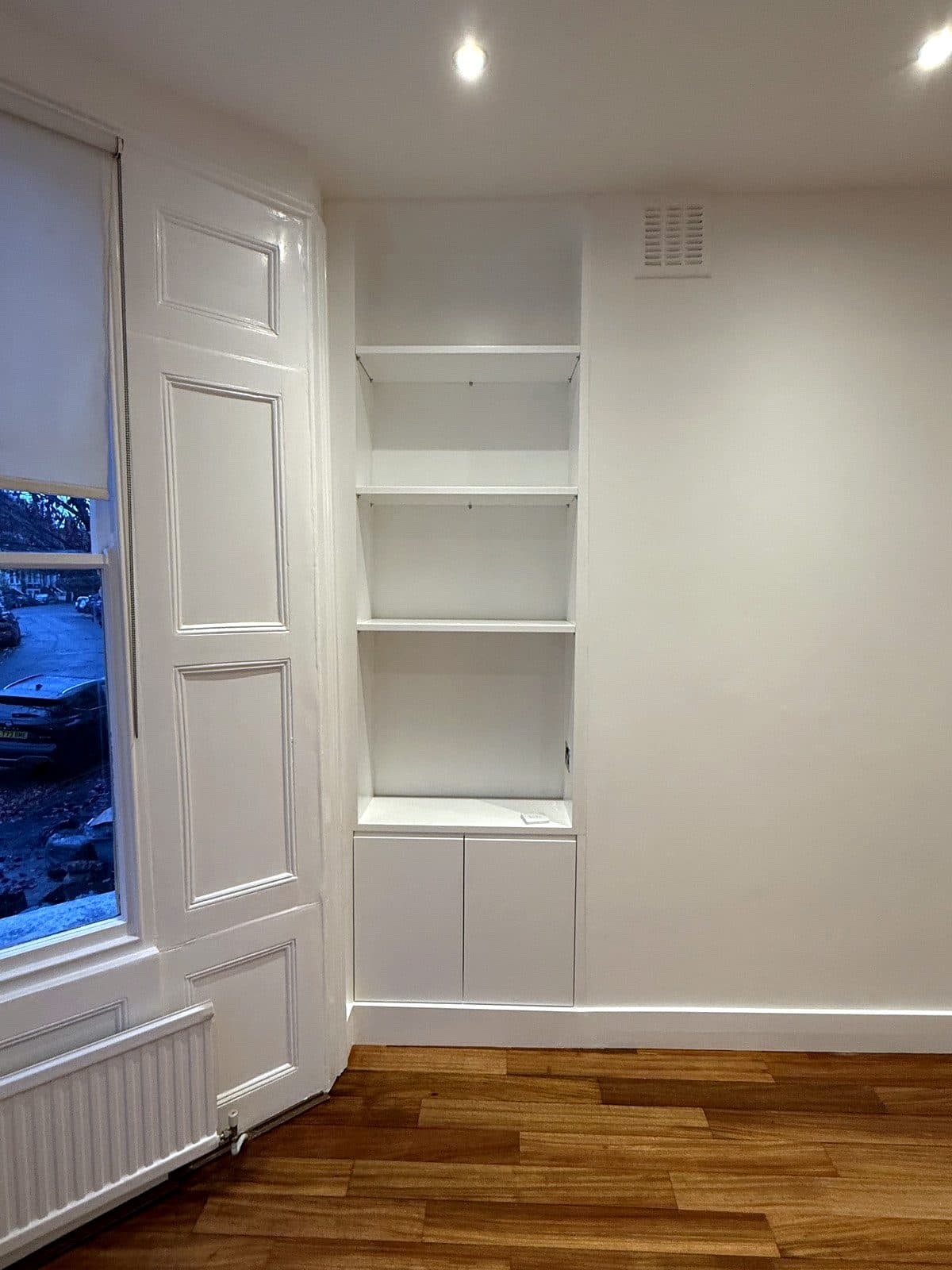 The alcove unit beside the folded window shutters