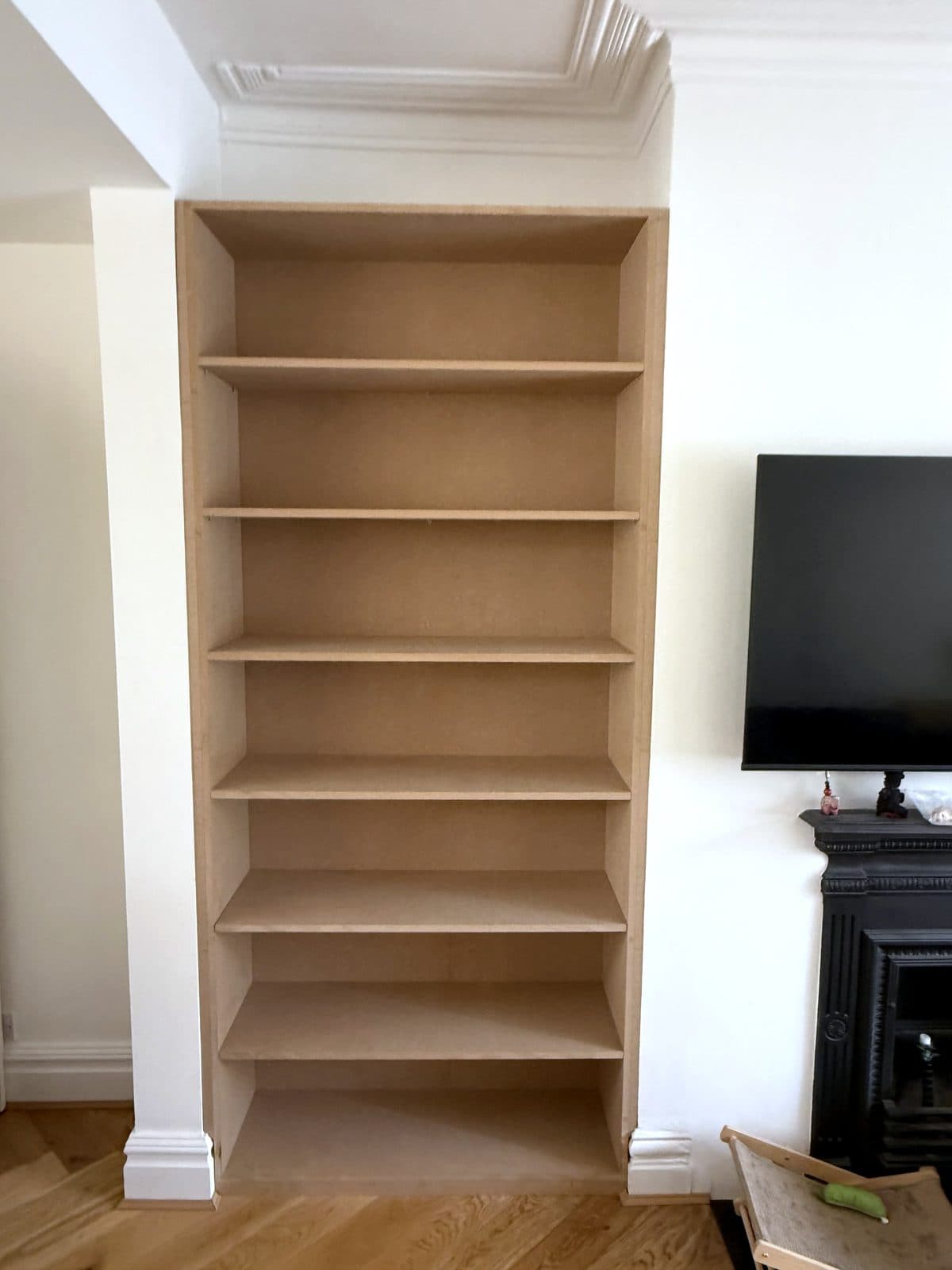 Left alcove with full-height MDF shelving