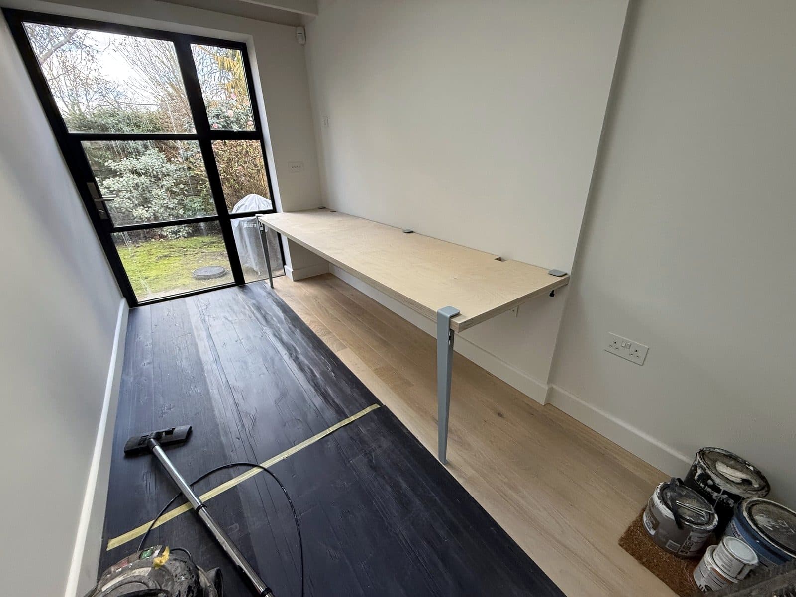 The desk running the length of the room