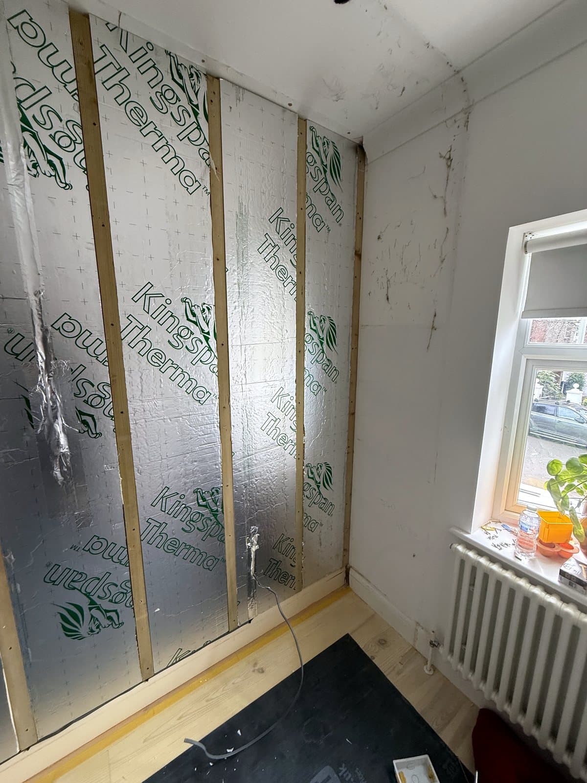 Insulation boards between battens on the outside wall