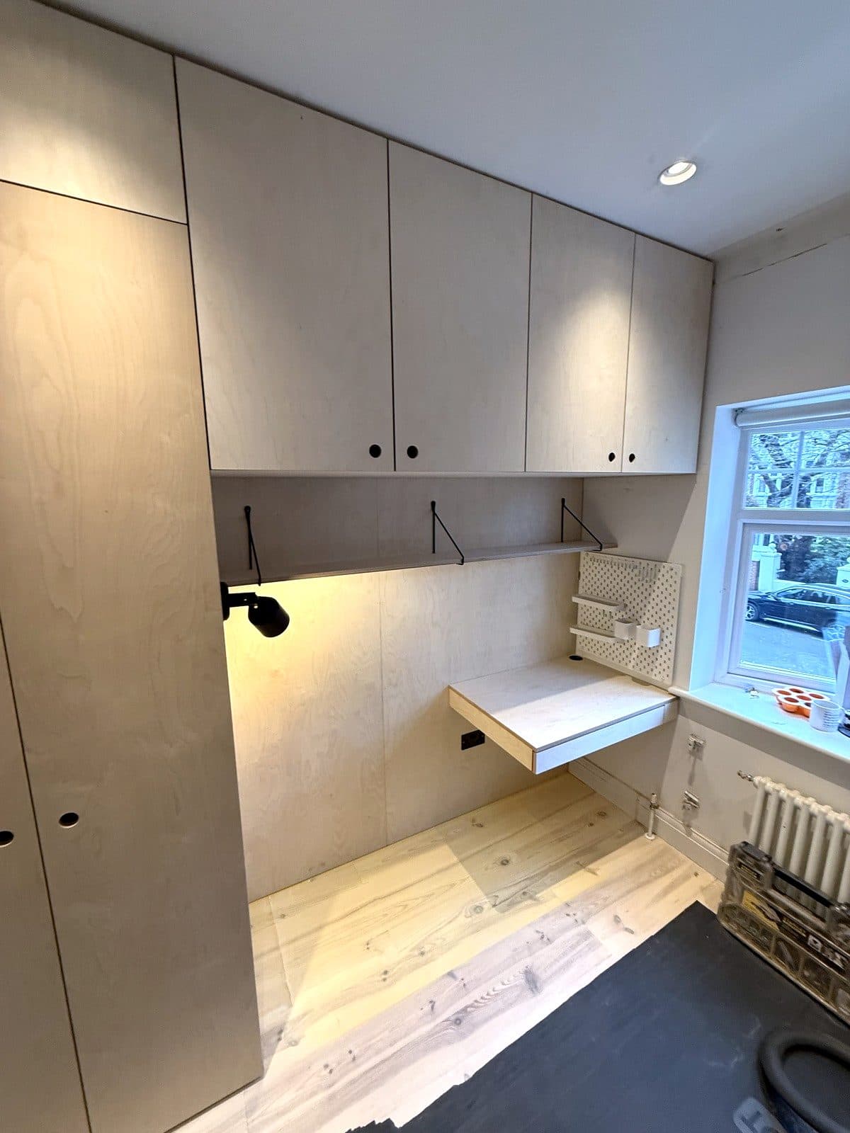 Wardrobe and overhead cupboards in birch ply