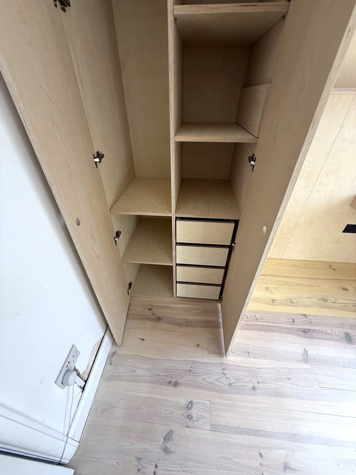 Inside the tall wardrobe