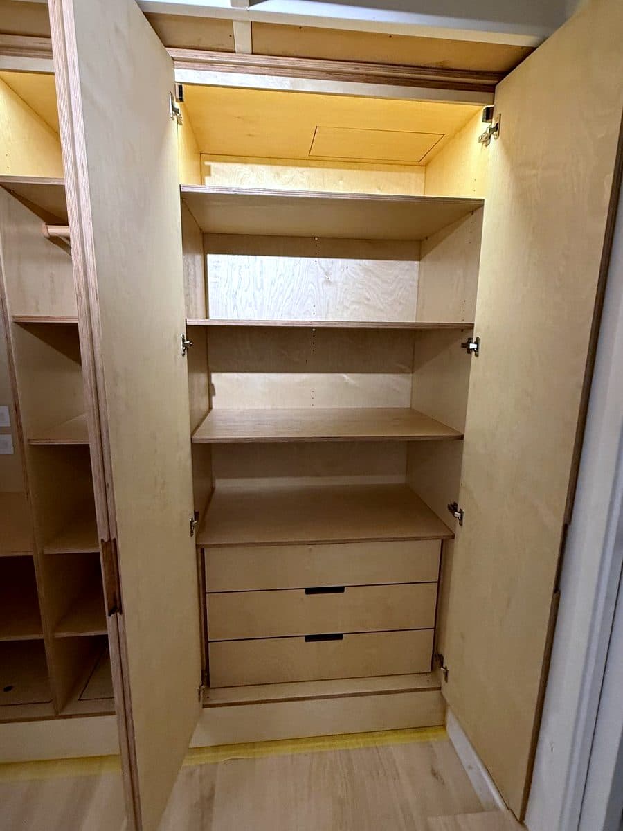 Right side open, with shelves over a stack of three drawers