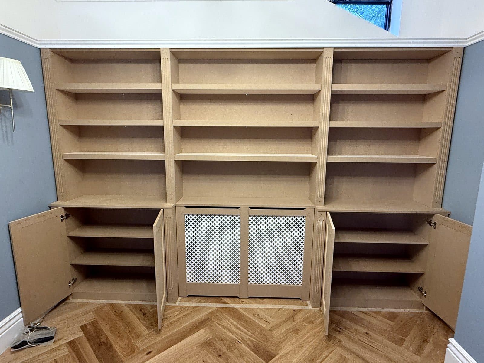 Cupboard doors open on both sides