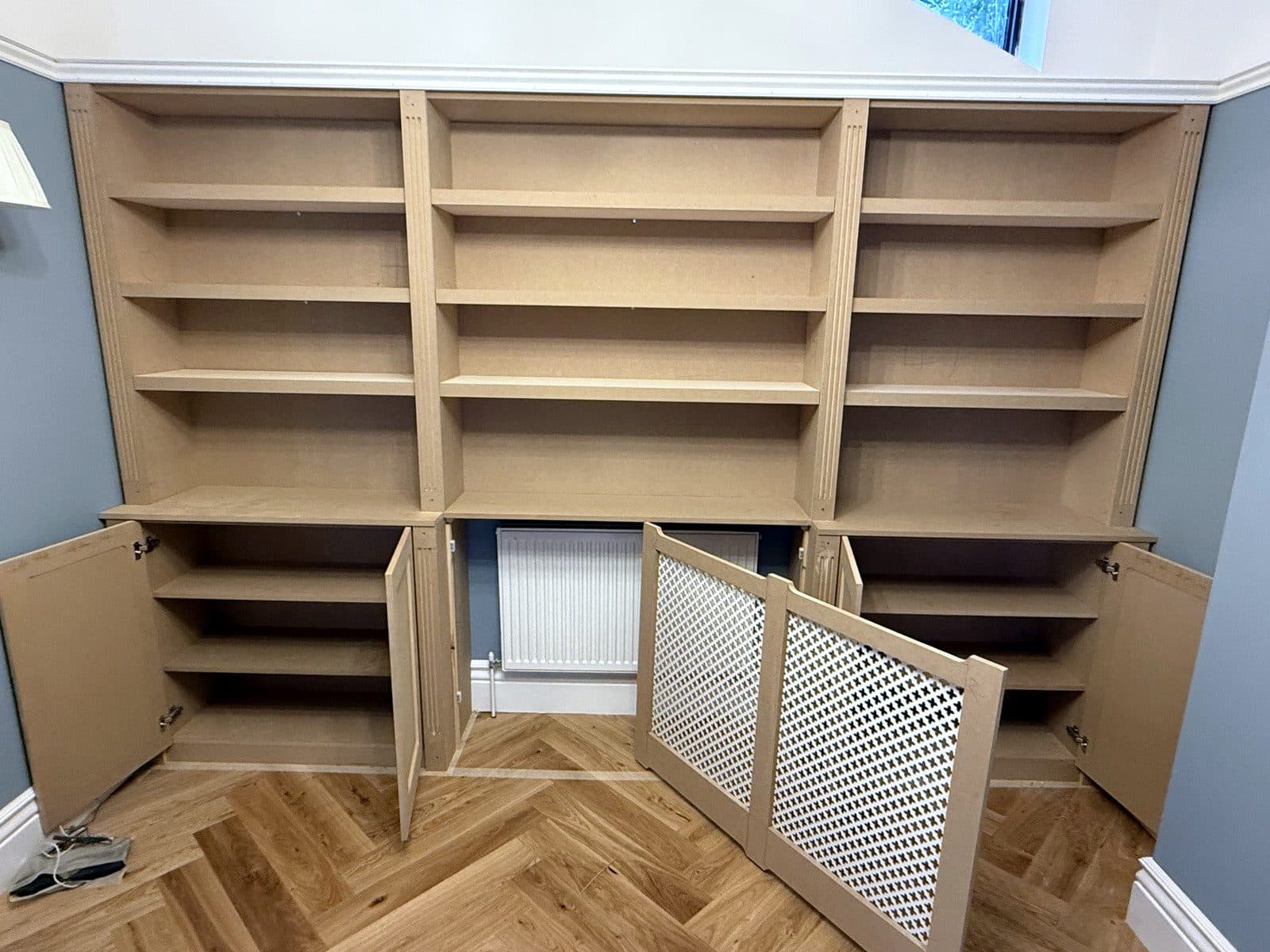 Radiator cover doors open, showing the radiator behind