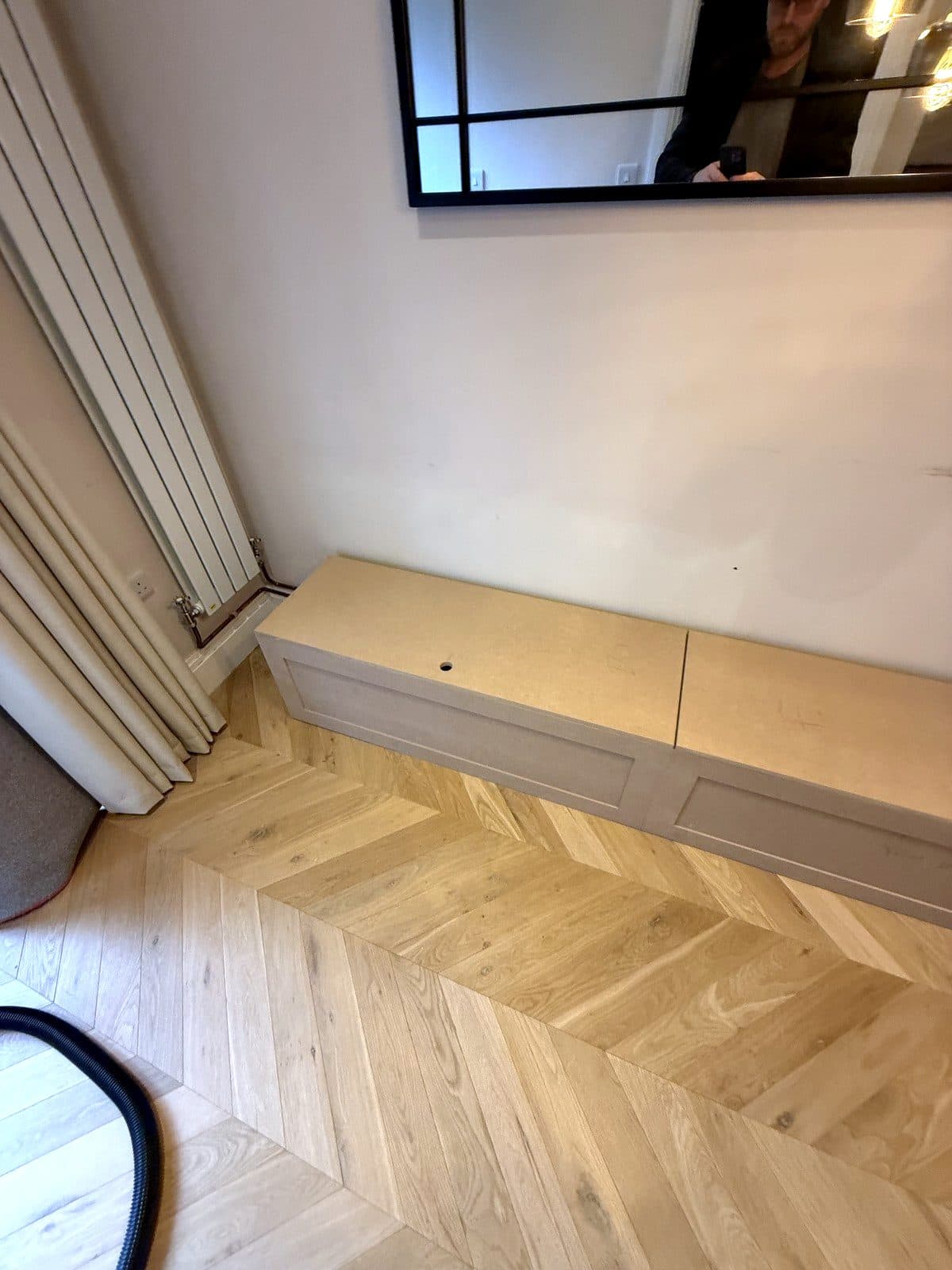 The long run of the bench under the mirror