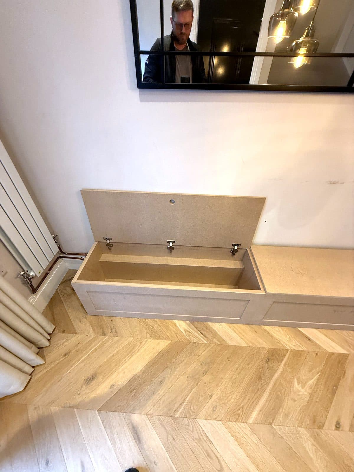 One lid lifted, showing the storage box and hinges