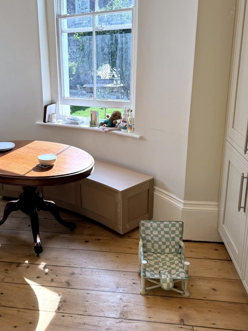 Curved bench and table by the window