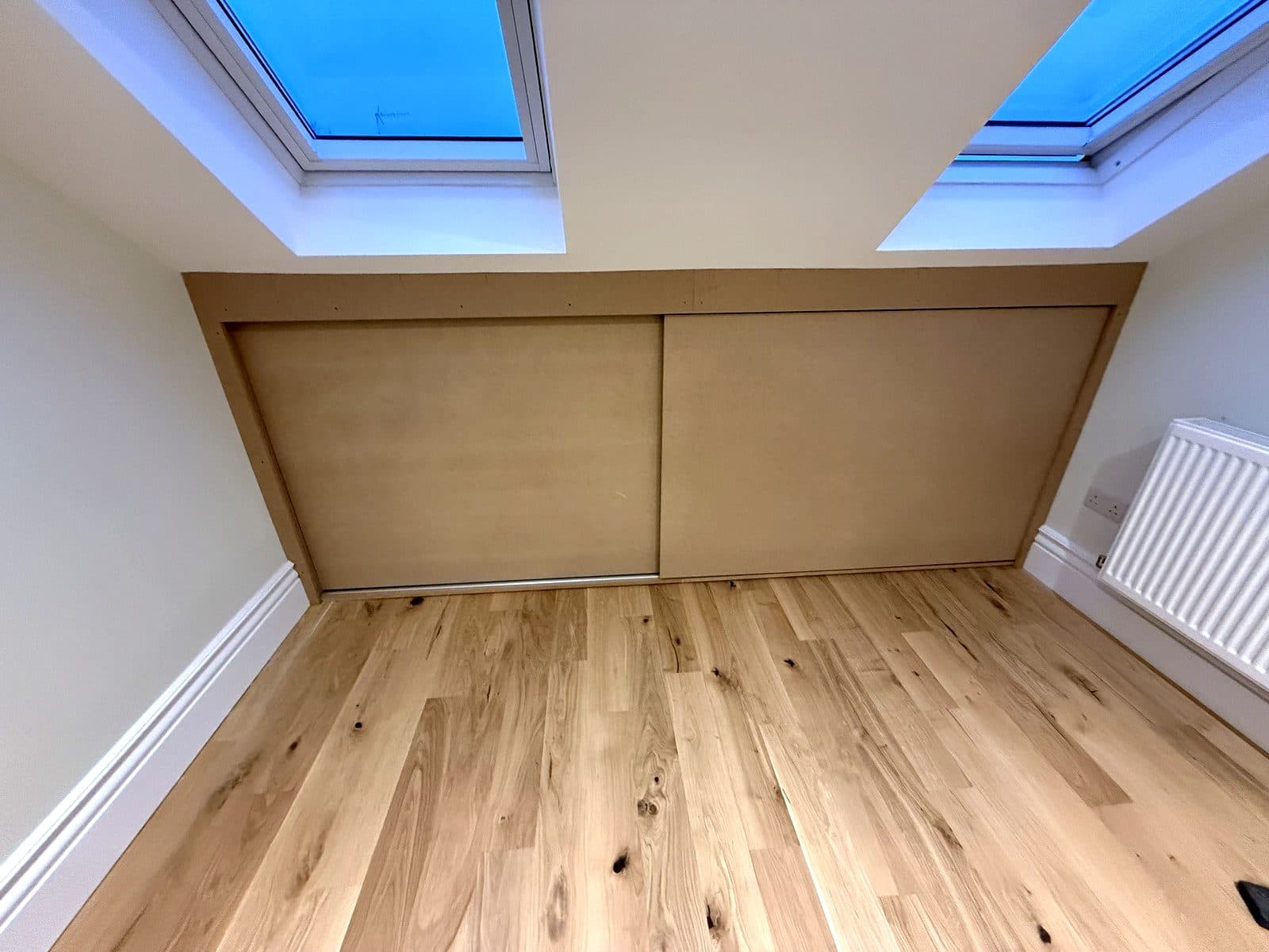 Both doors closed under the skylights