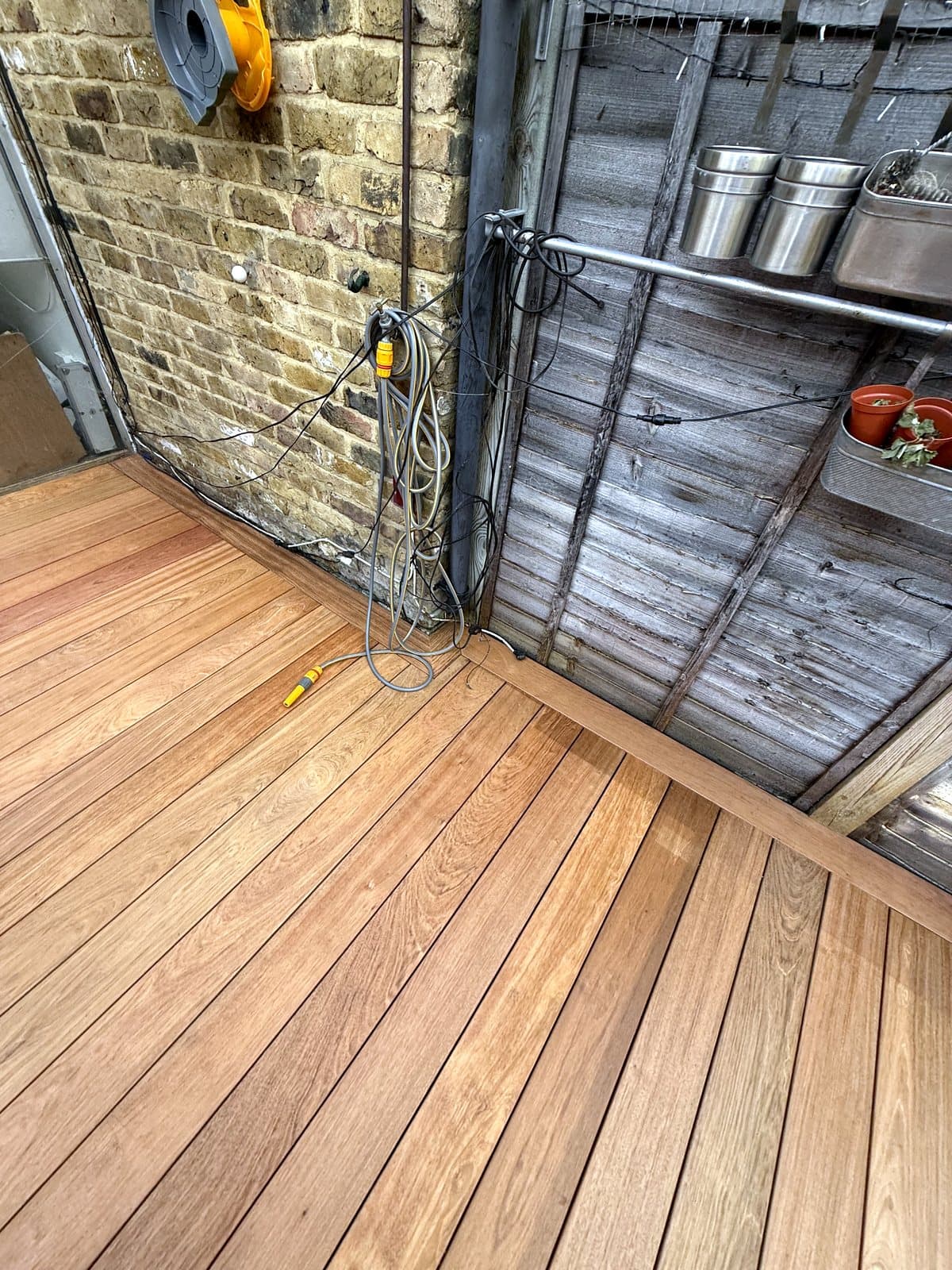 Deck along the fence by the doors