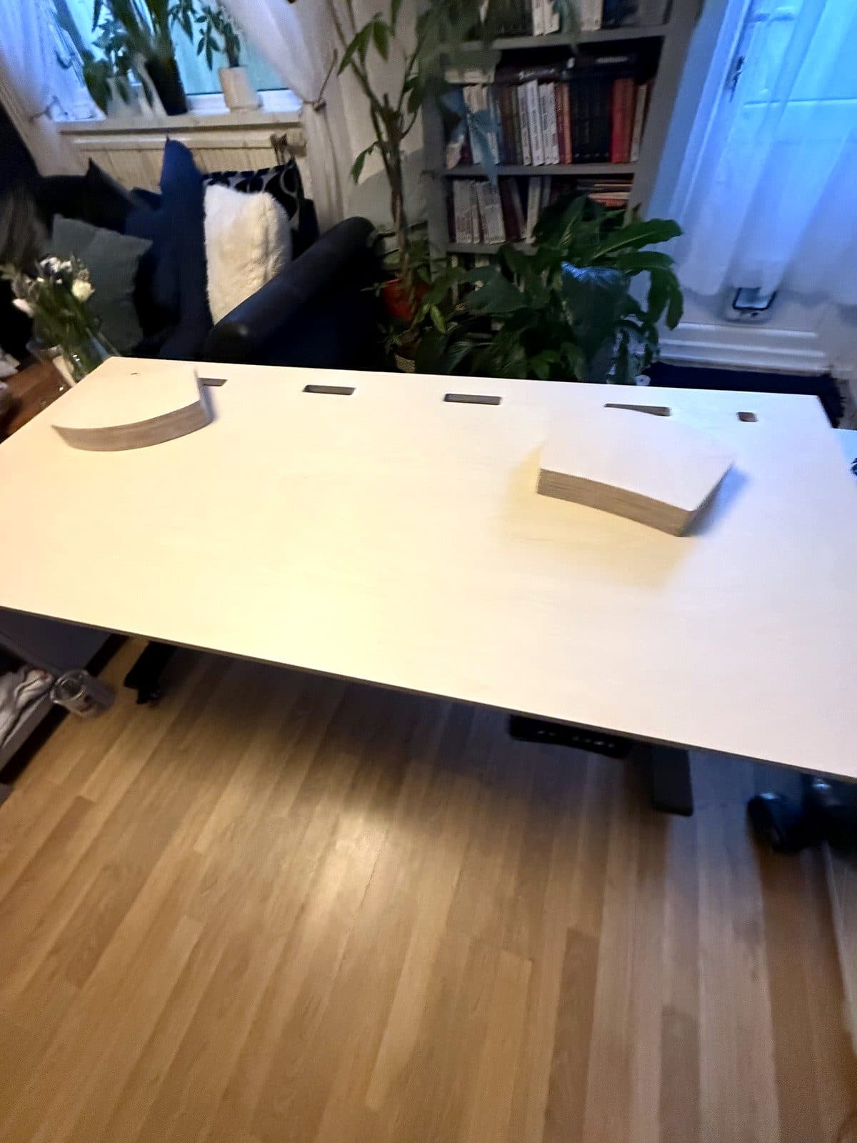 The desk top with cable slots and the two stands