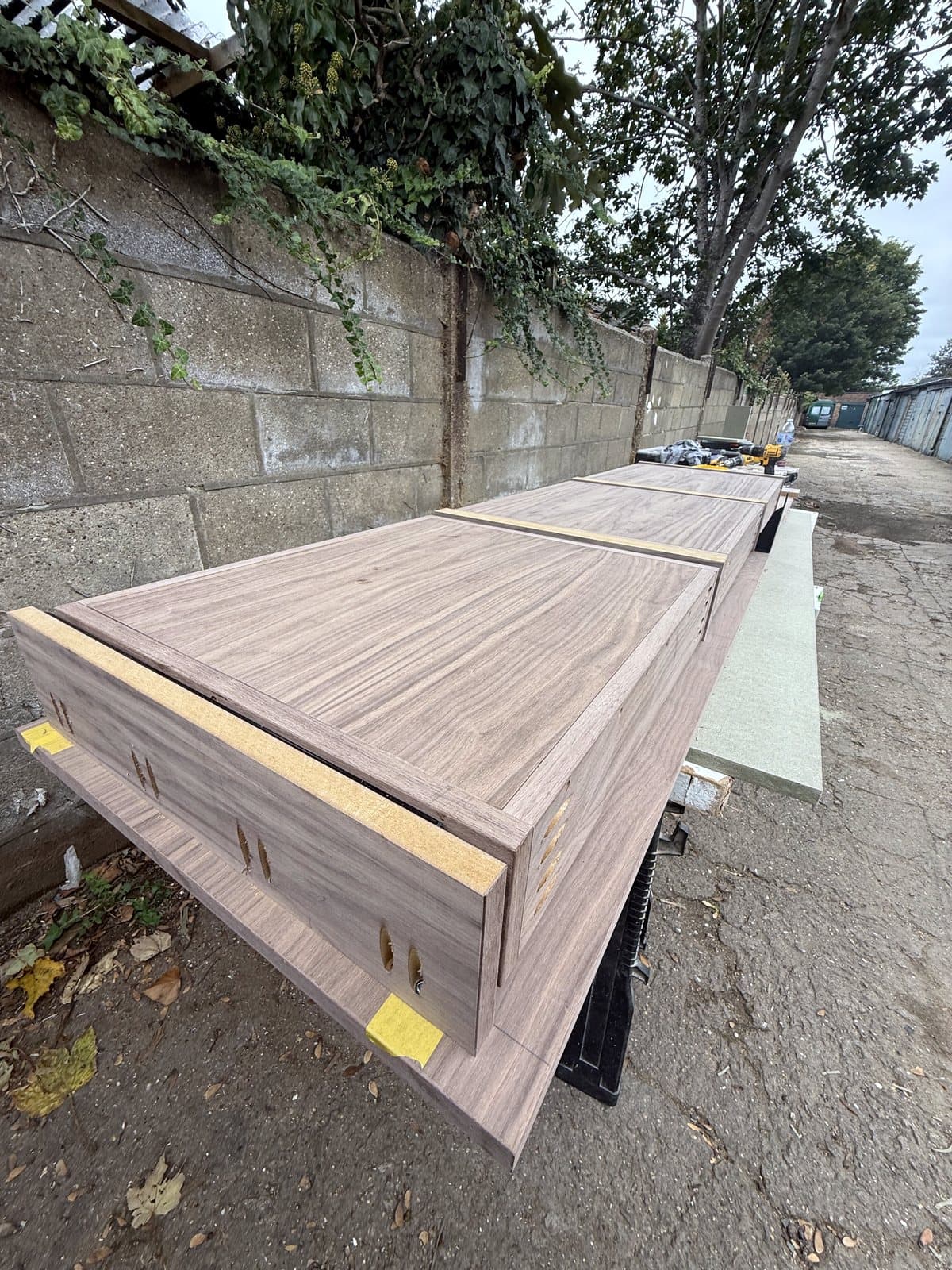 The desk parts lined up on trestles