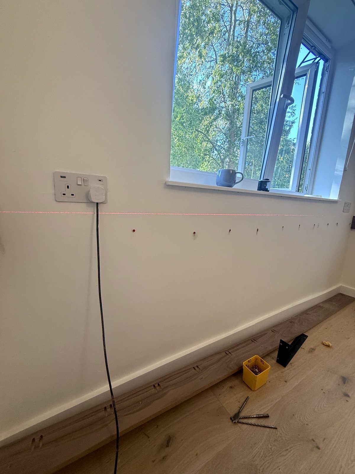 Fixing points marked along the wall