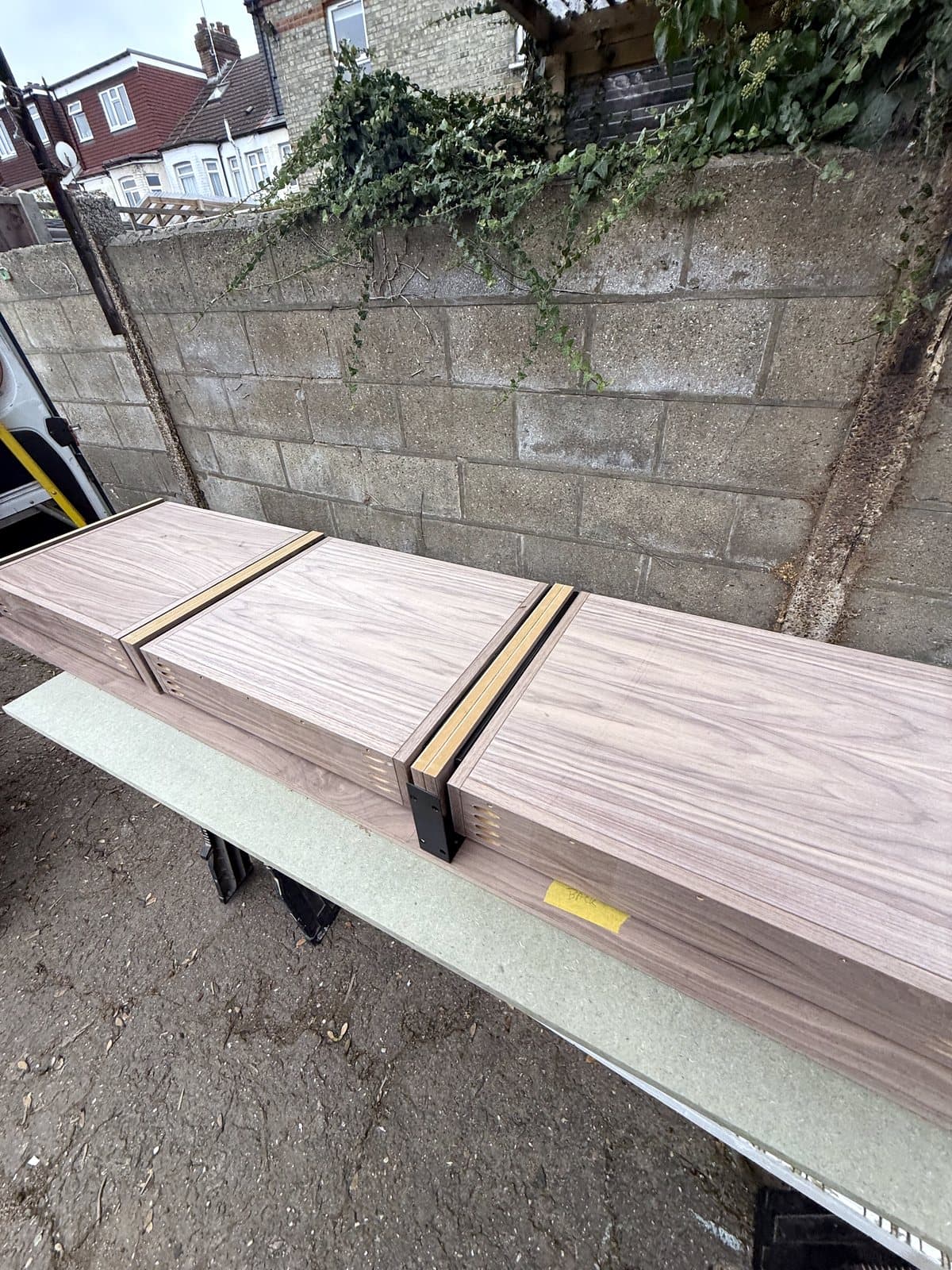 Walnut pieces with tape along the edges