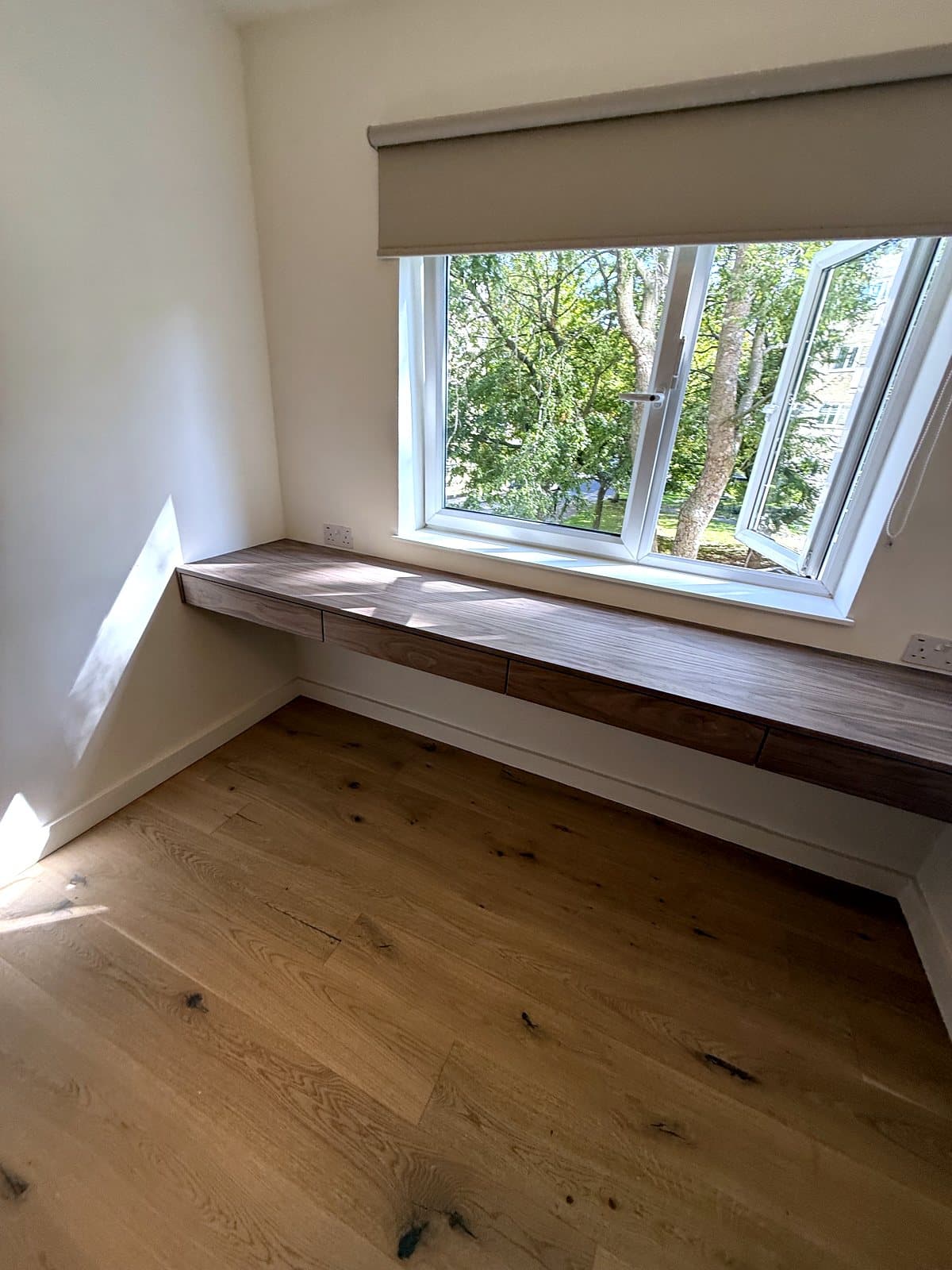 Desk along the window wall