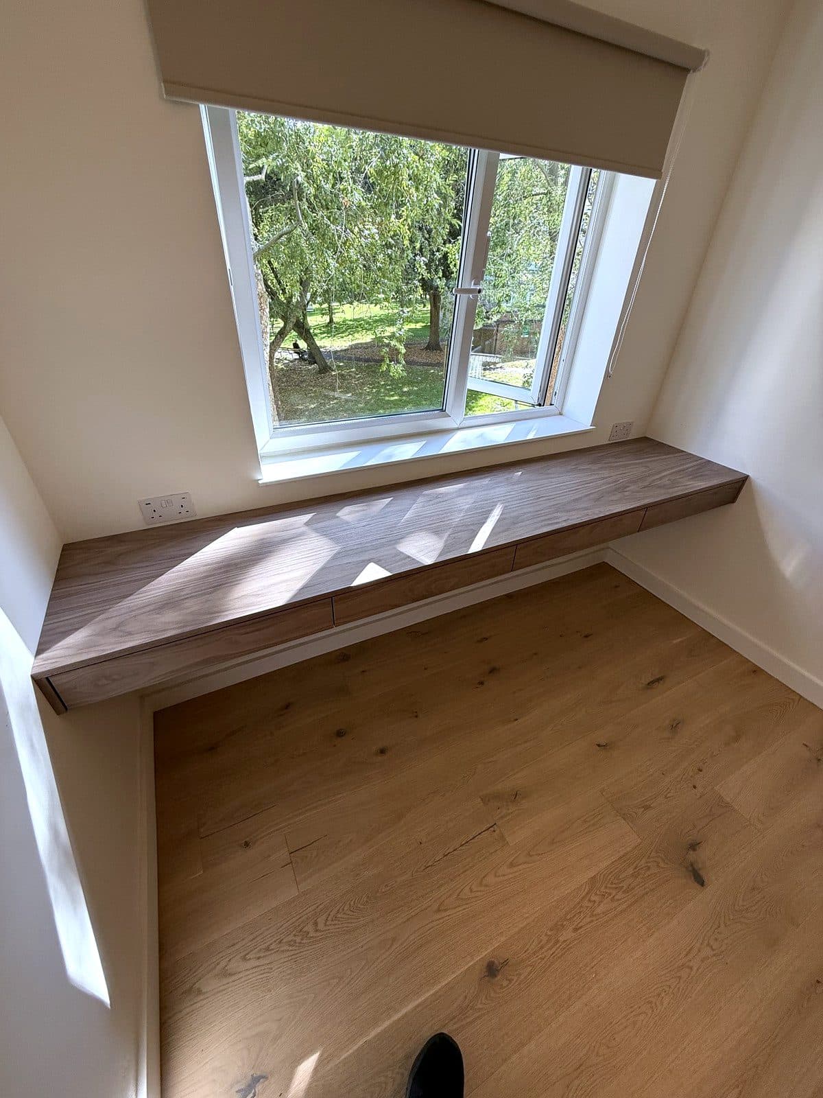 The desk from the far corner