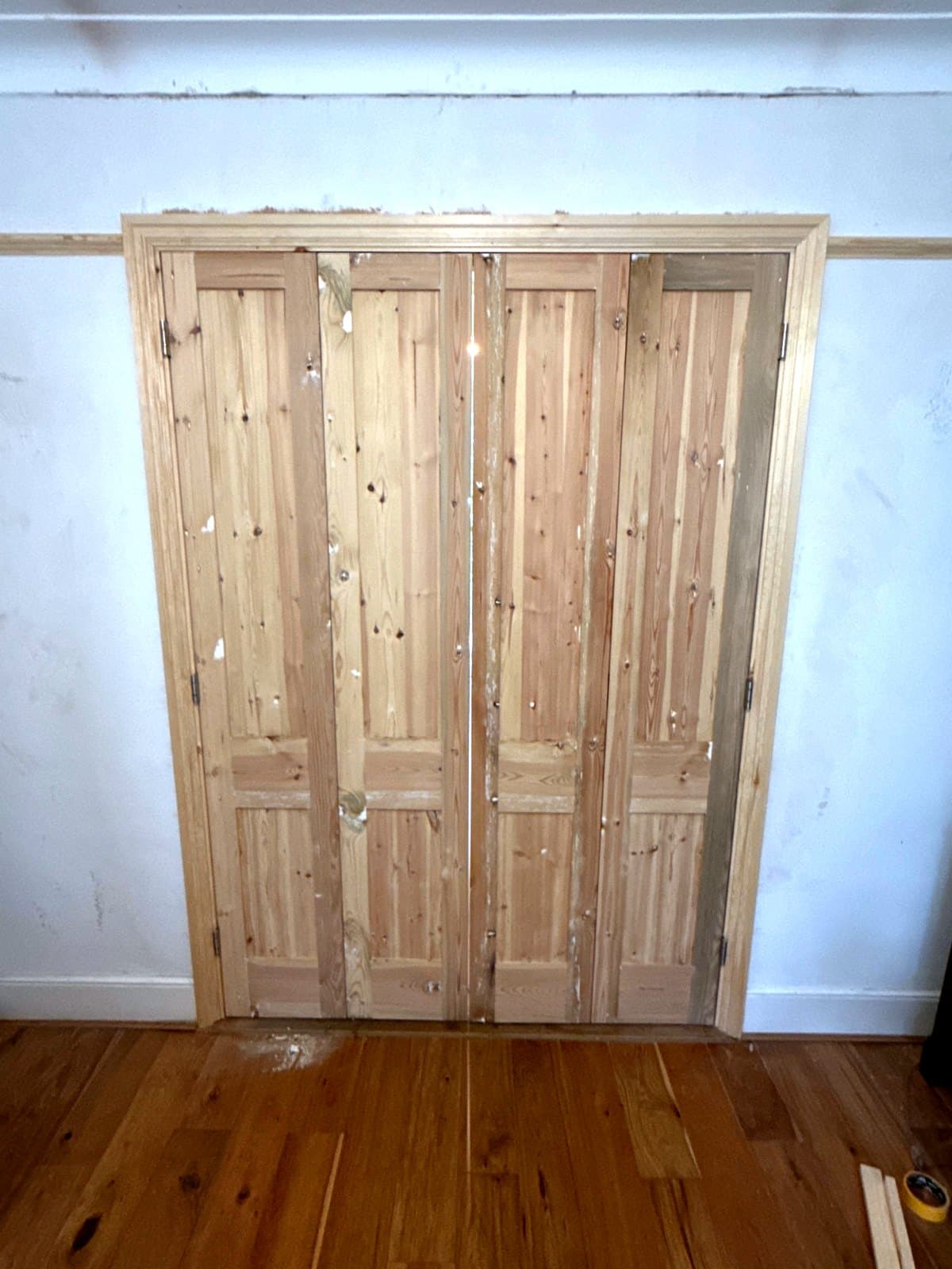 Straight on to the closed doors, with the knob on a middle door