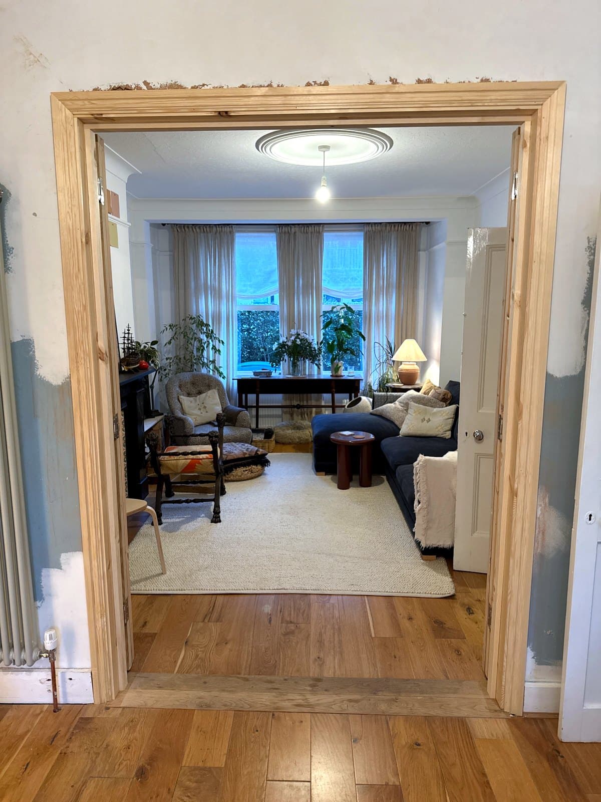 The doors folded open, looking through to the front room