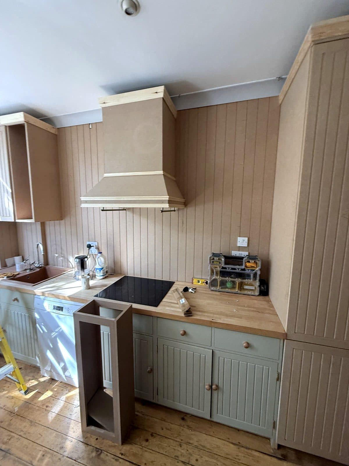 Cooker hood and tall unit