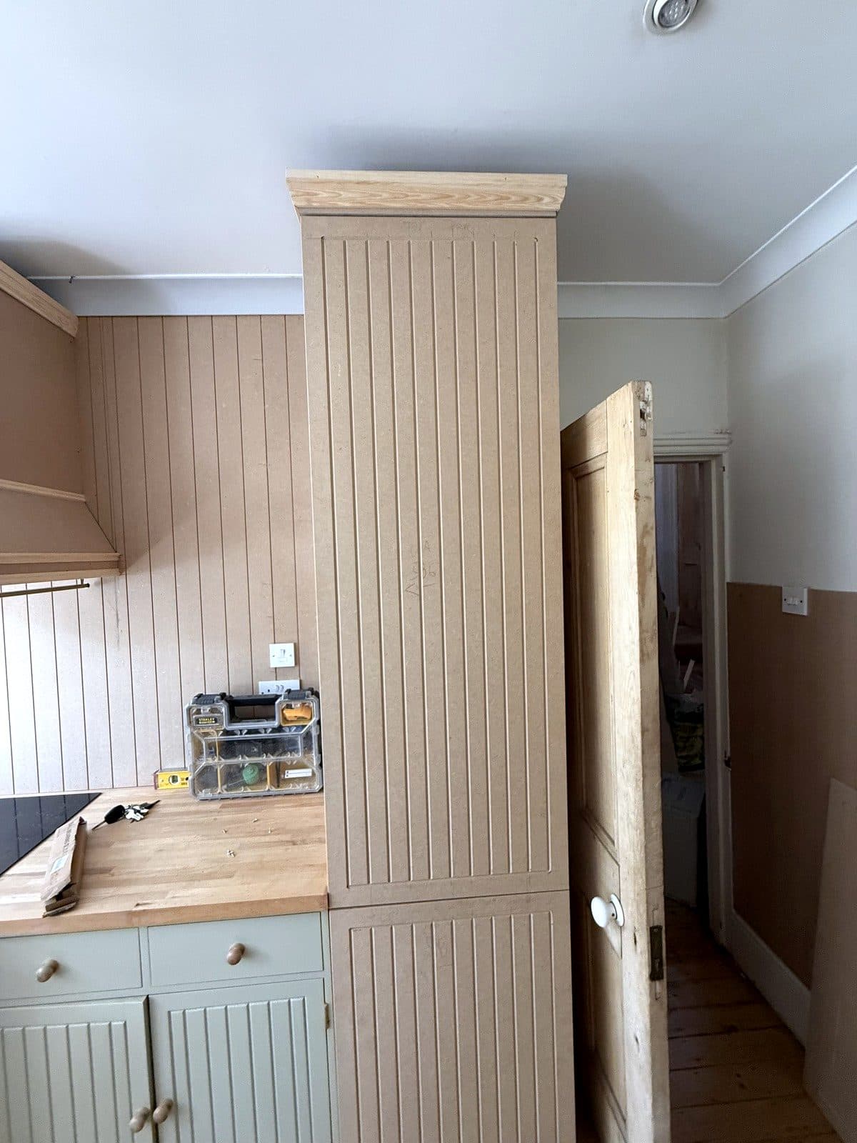 Tall panelled unit at the end of the run