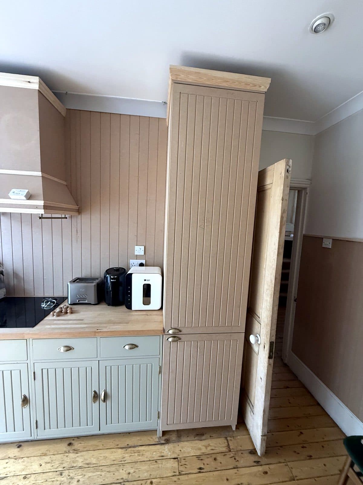 Panelling, hood and tall unit together