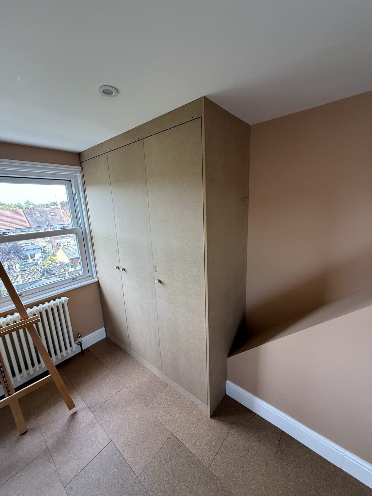 Wardrobe boxed in beside the sloping wall