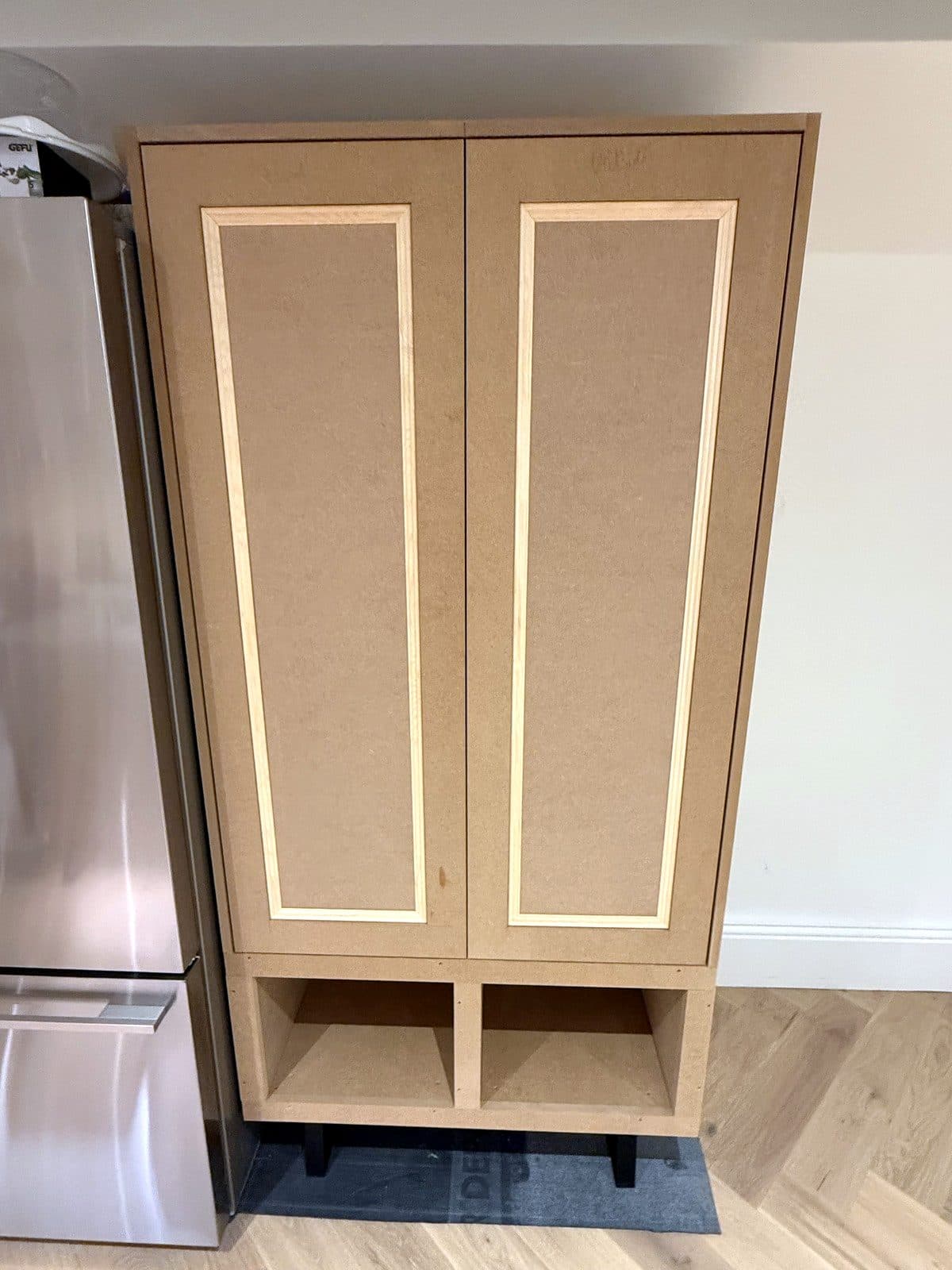Pantry cupboard with the two framed doors closed