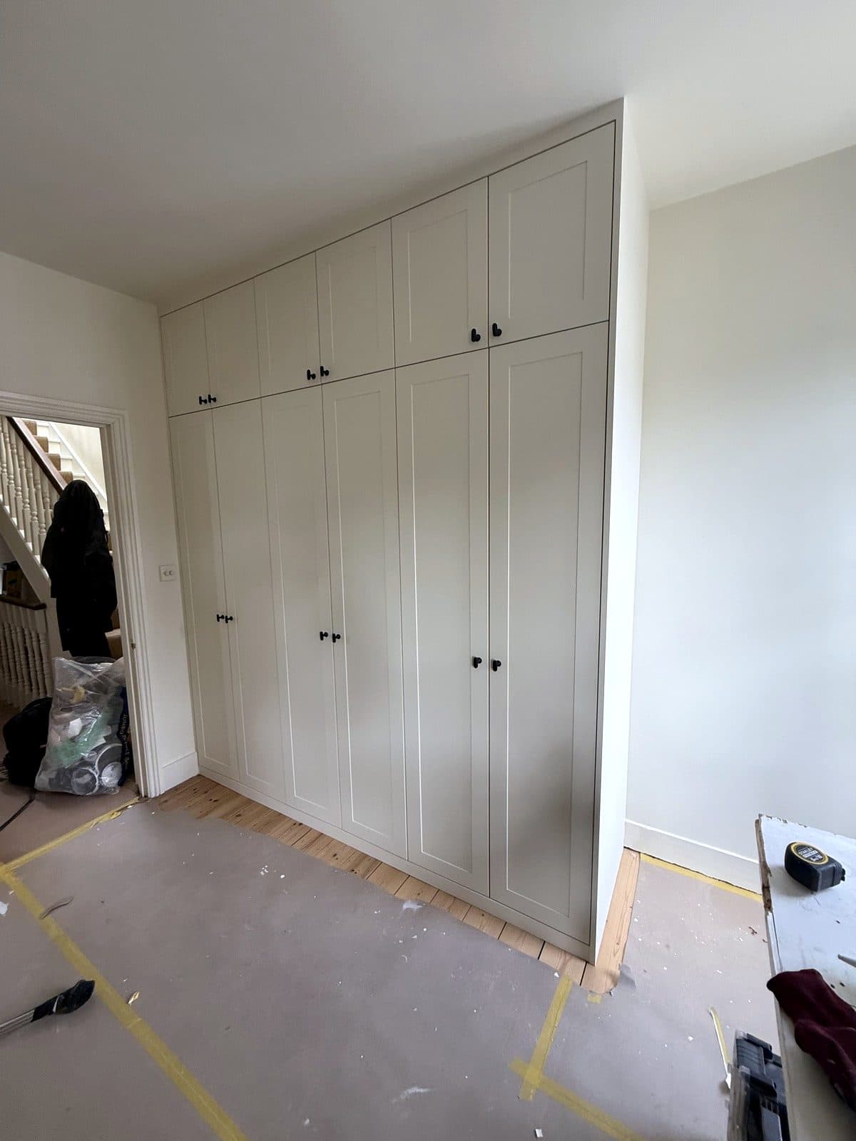 Wardrobes beside the doorway