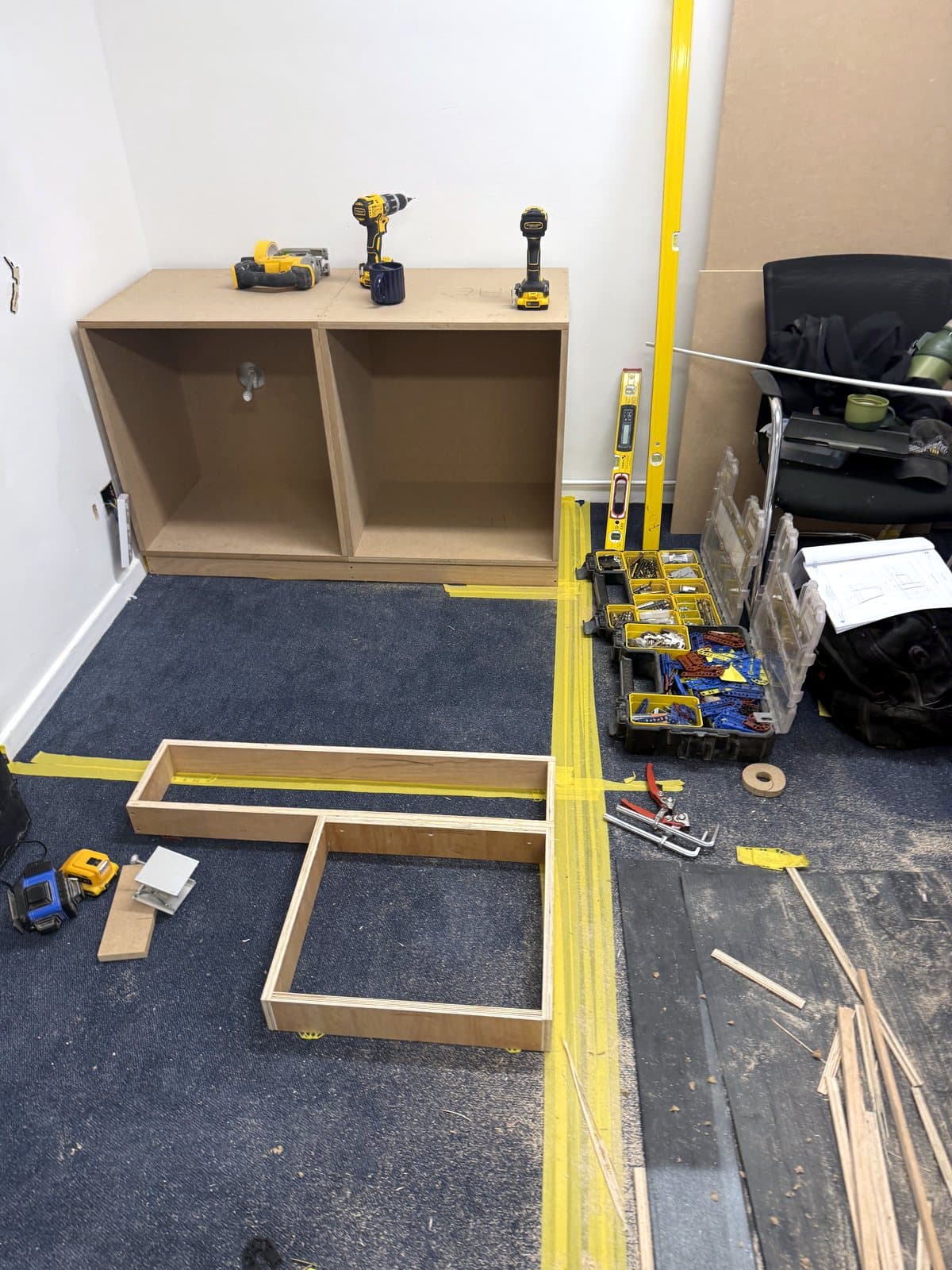 Plinth frames on the carpet beside a carcass