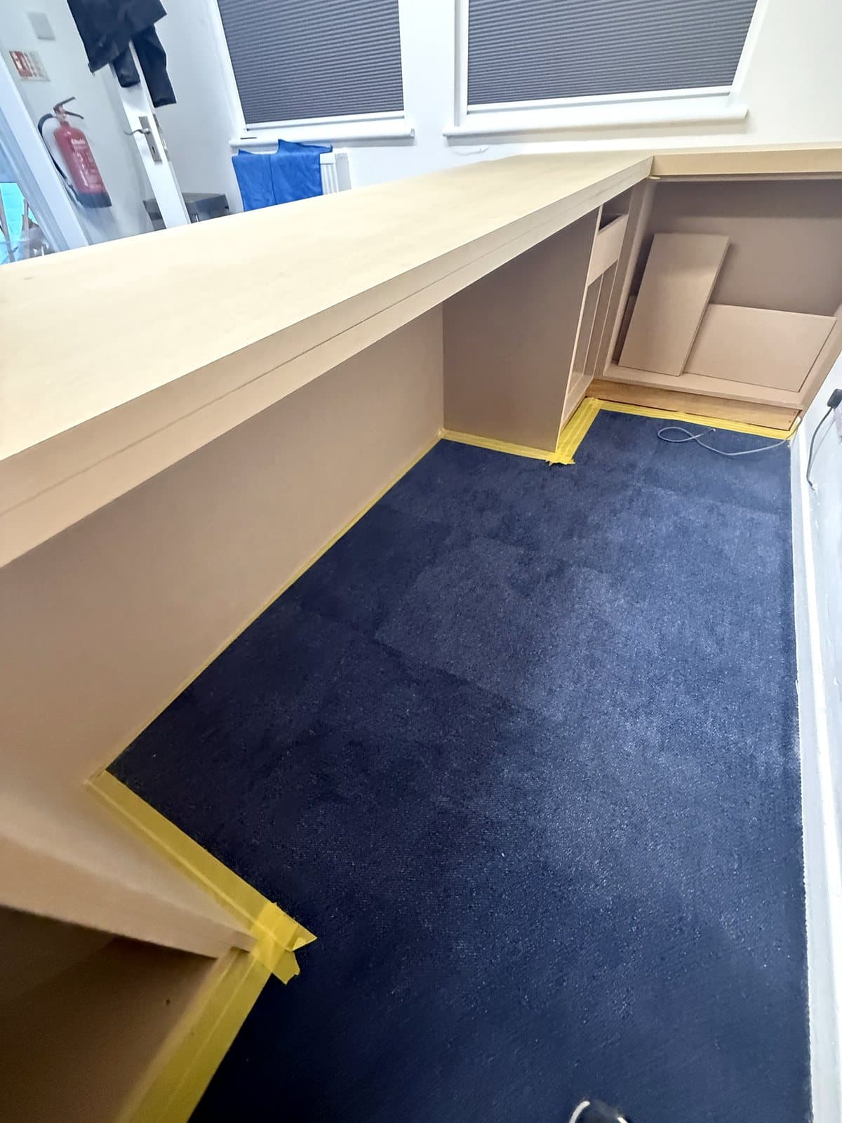 Inside the L: open storage under the top