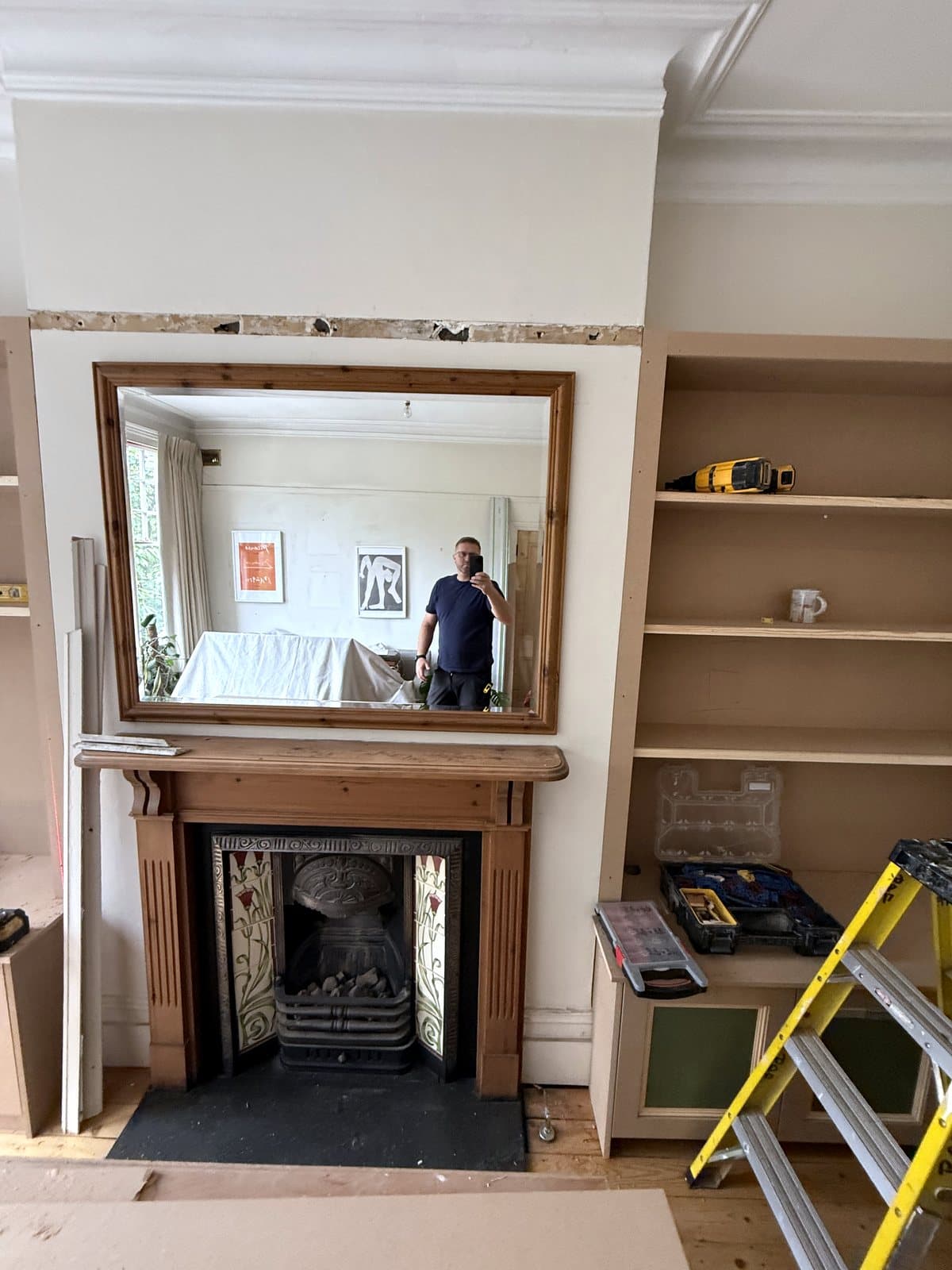 Right alcove shelves beside the fireplace