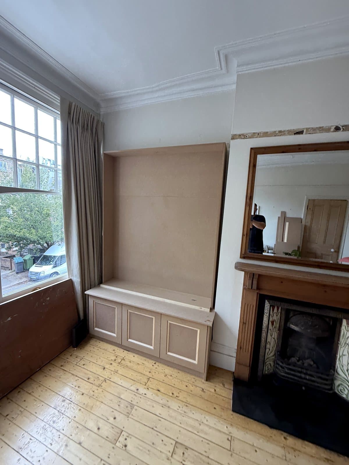 Base cupboard and back panel in the left alcove