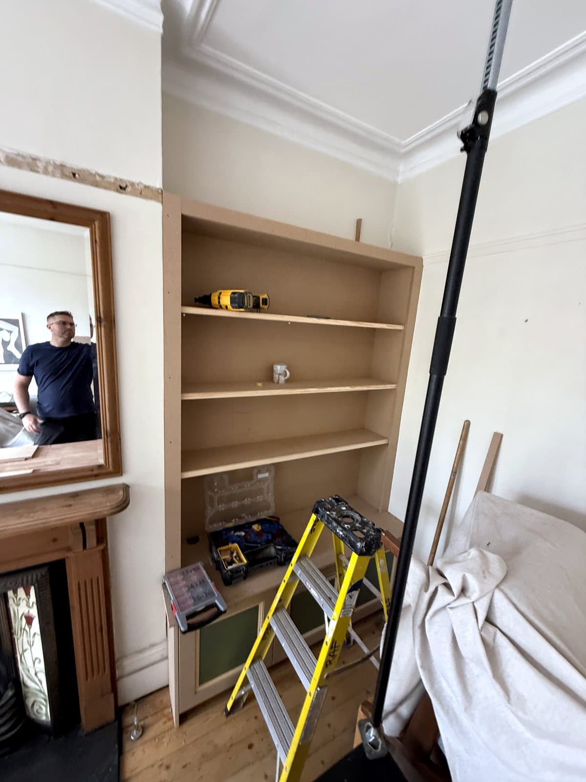 Shelves going up in the right alcove