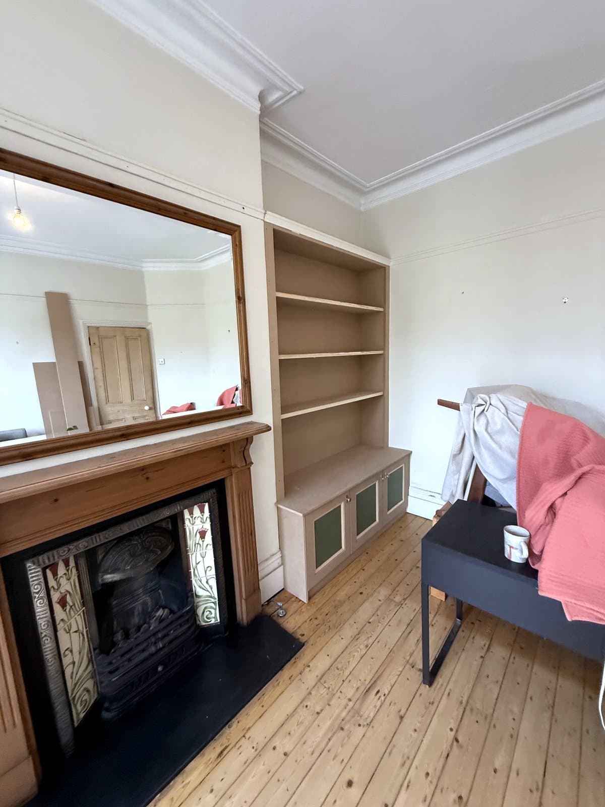 Bookcase side with green inset panels