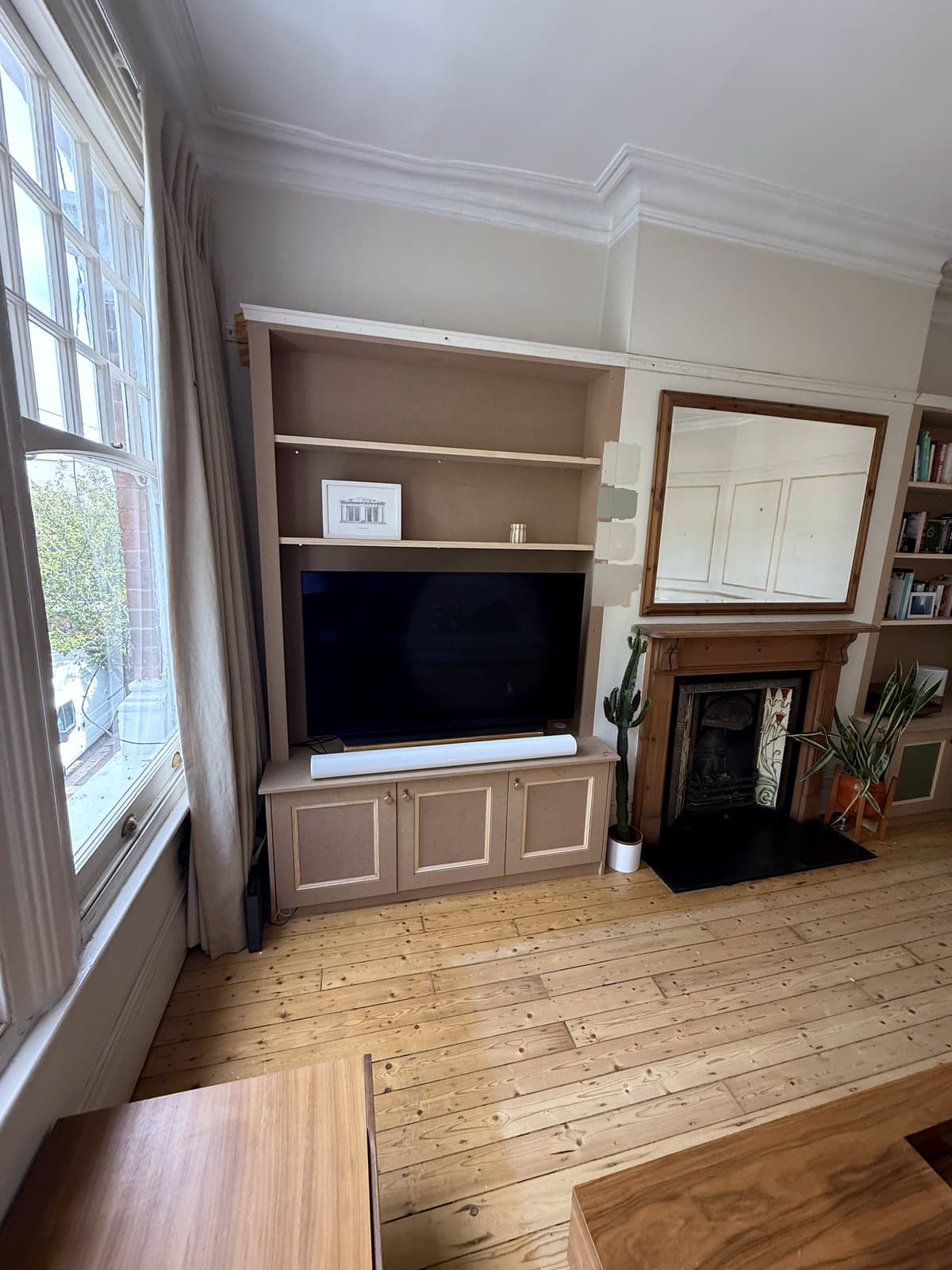 TV unit and fireplace from the window side
