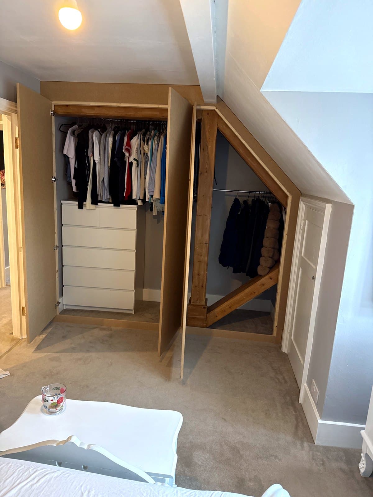 All three doors open, with rails on both sides of the timber post