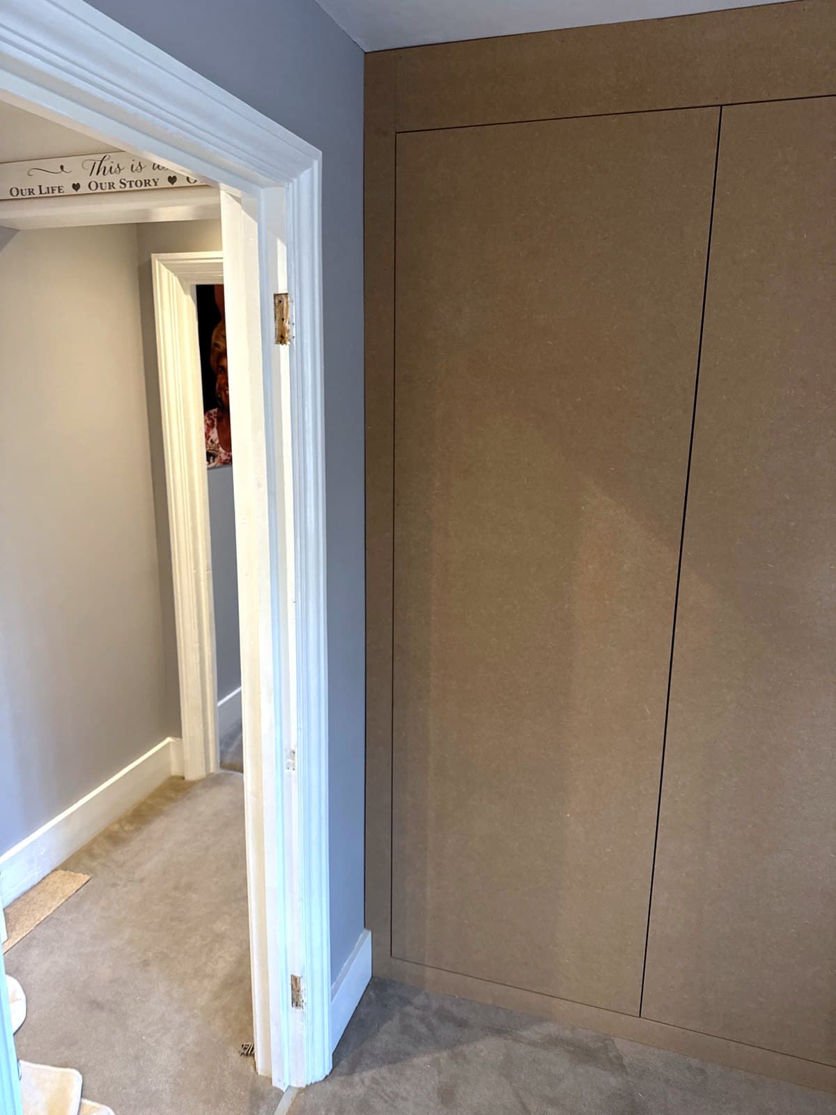 The wardrobe beside the room's doorway