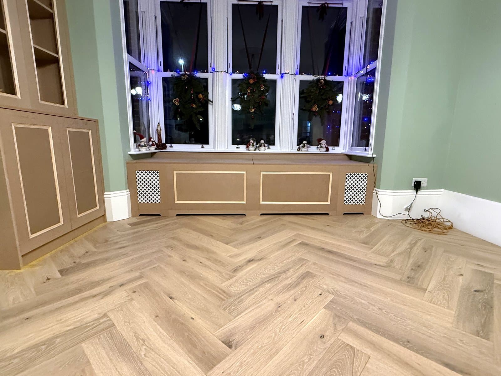 Cabinet and window seat across the room