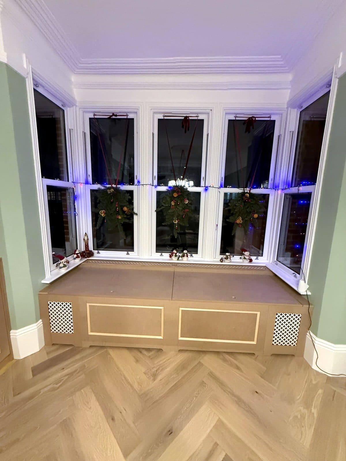 Window seat across the bay with panelled front