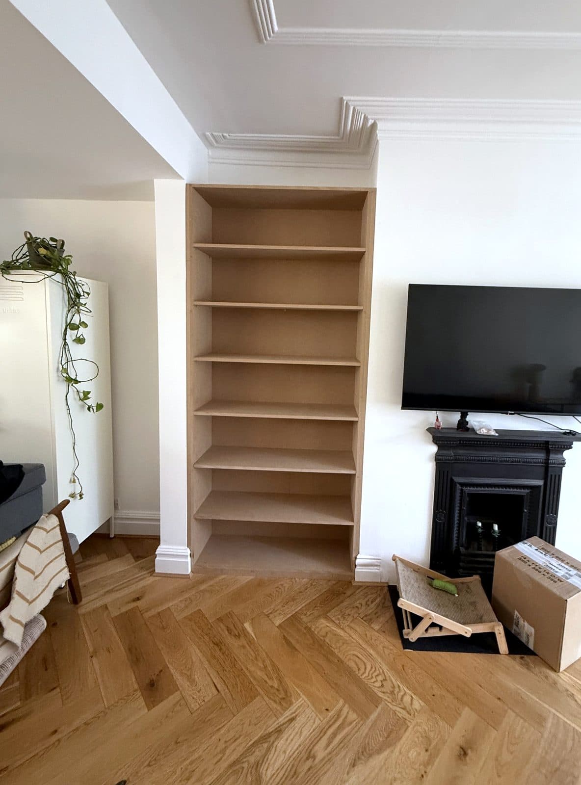 The same alcove with full-height MDF shelves fitted