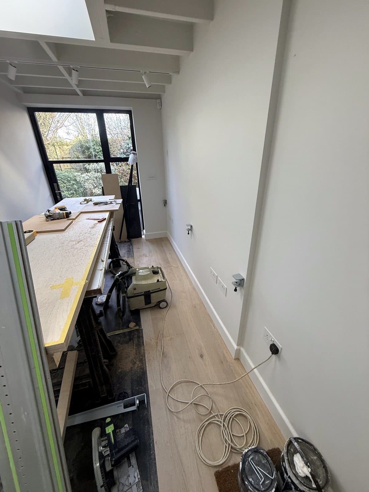 Birch ply boards on trestles in the garden room