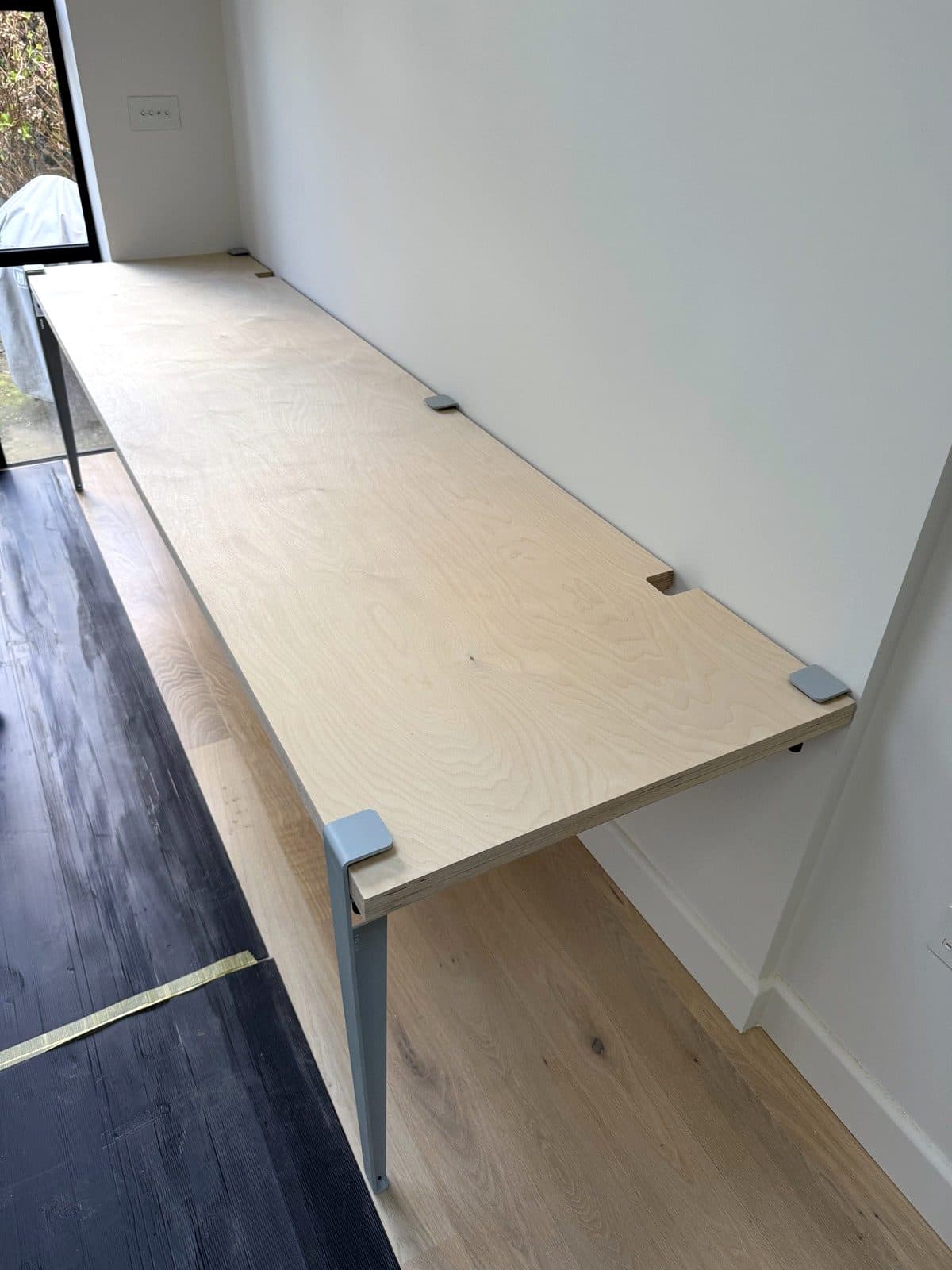 Desk top fitted on steel legs
