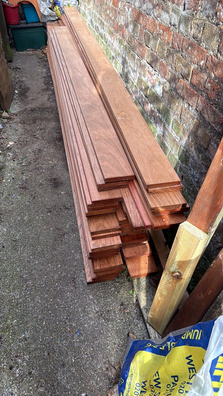Stack of deck boards along the side wall