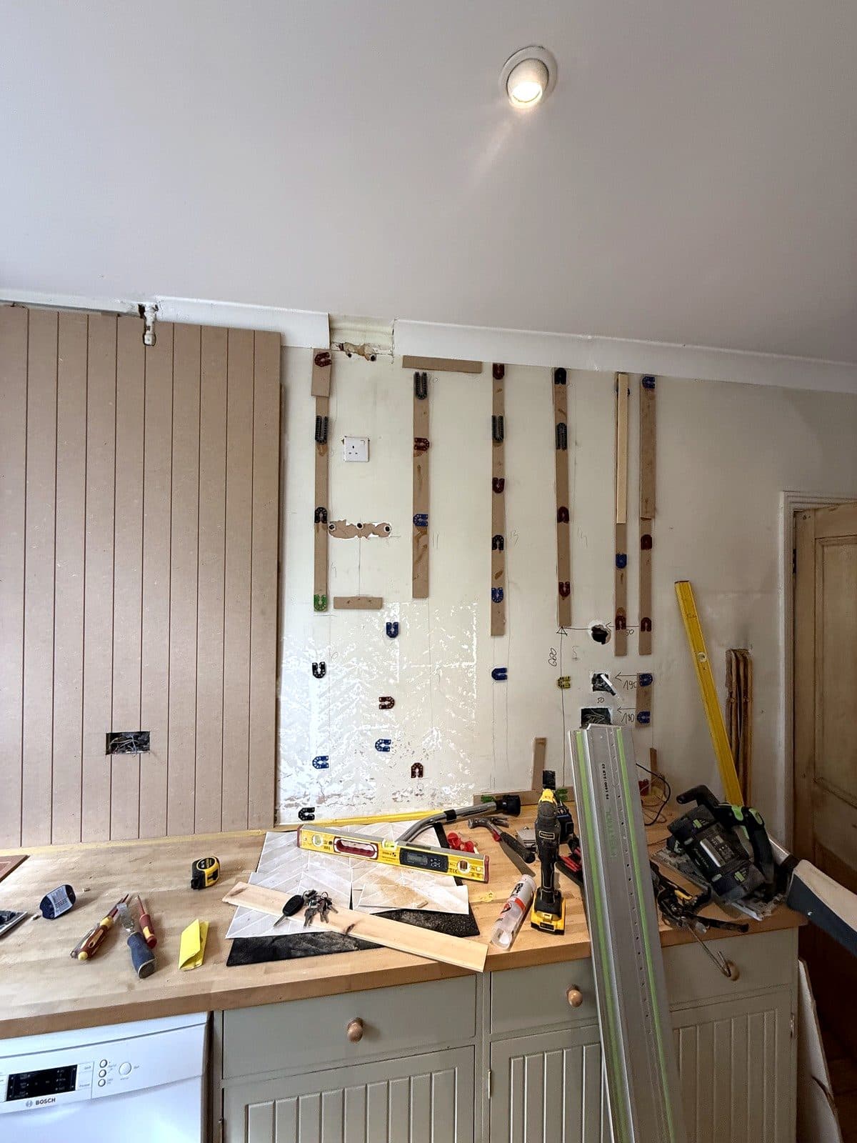 V-groove panels going up behind the sink