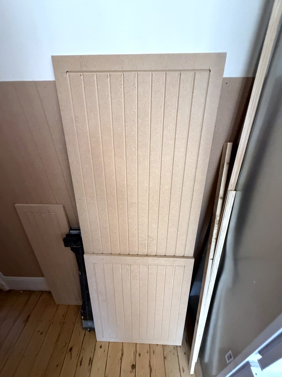 Tall panelled door being made