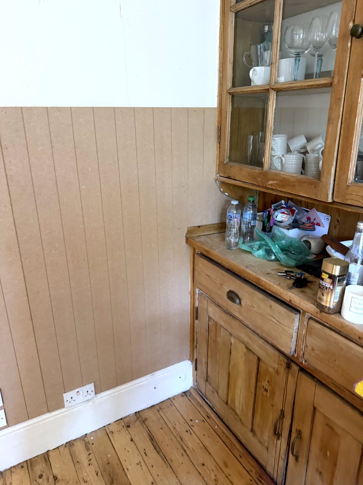 Dado-height panelling beside the dresser