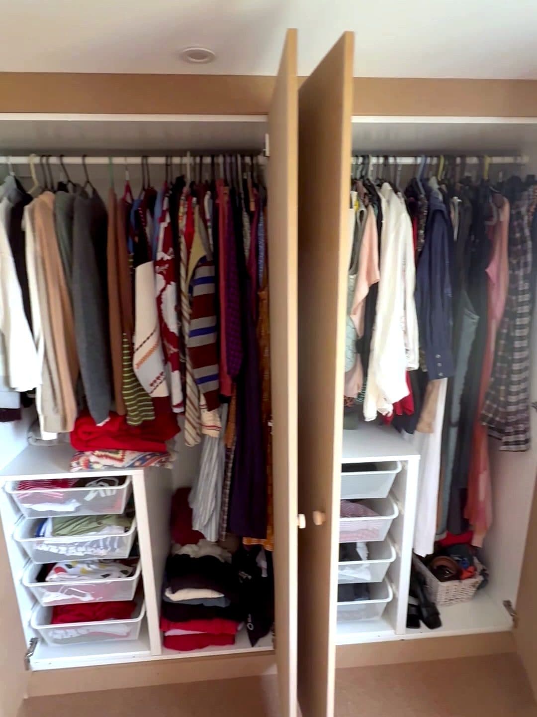 The finished wardrobe open, with drawers and hanging rails as planned