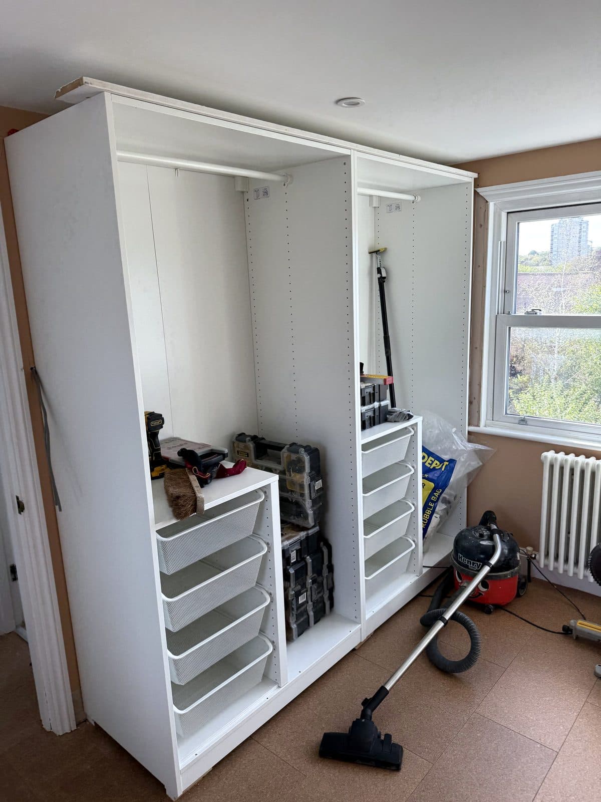 White PAX frames with wire drawers, tools on the floor