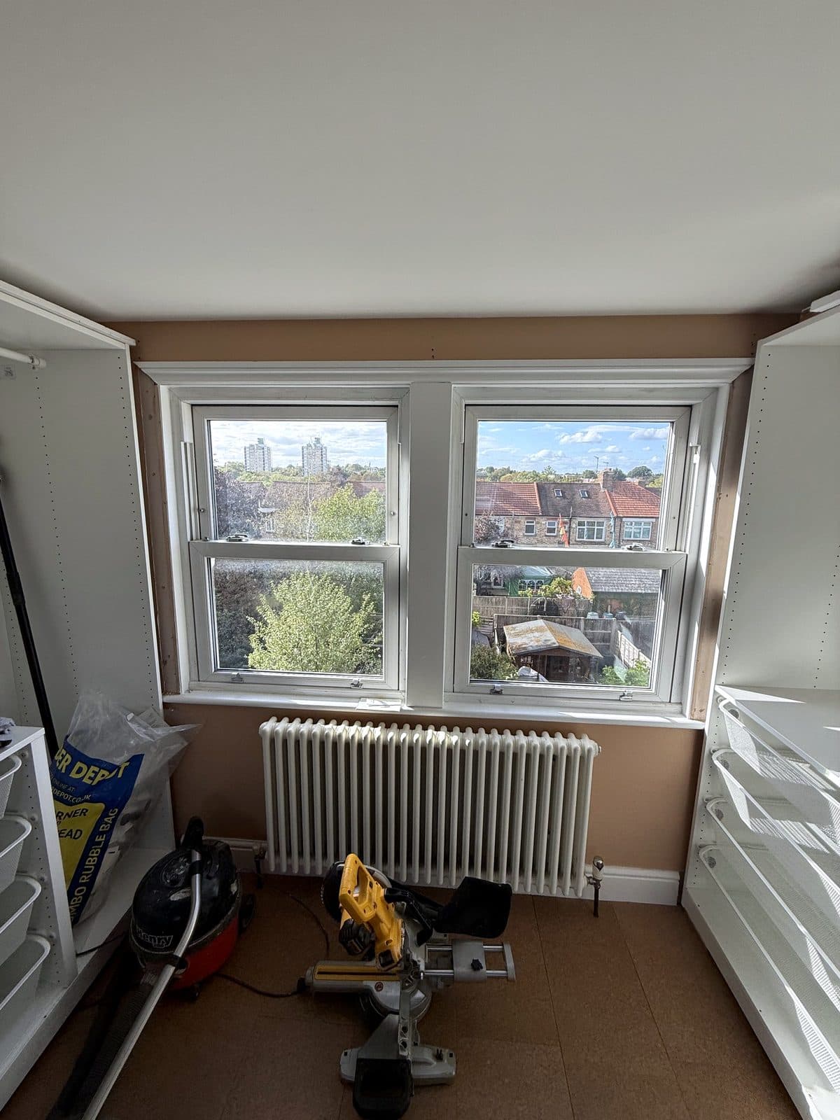 PAX frames along both walls with the window in the middle